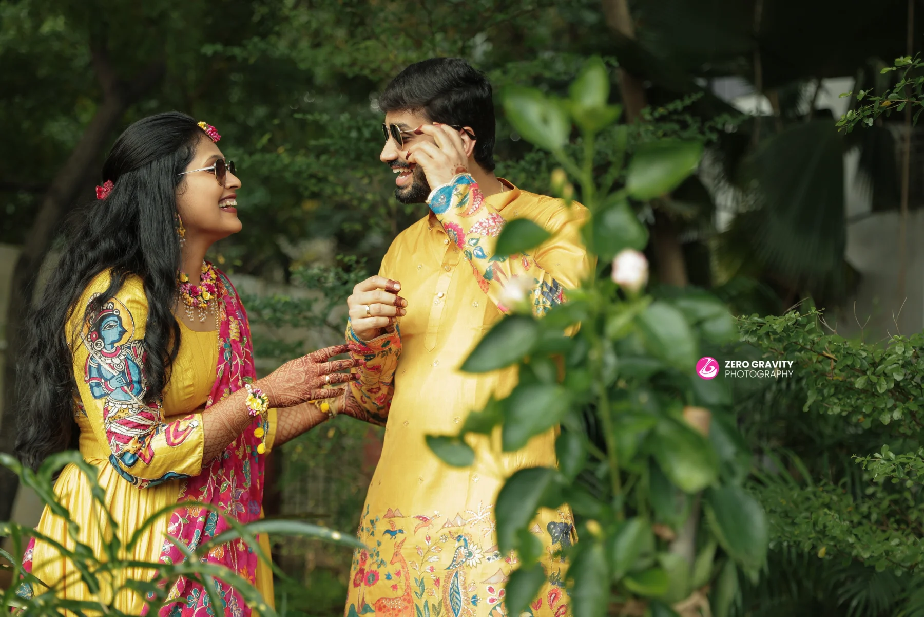 Stylish groom with bride in bridal lehenga – wedding portrait