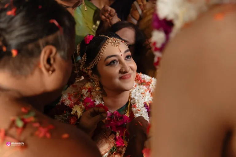 Bride’s hands adorned with intricate jewelry during wedding ceremony — candid wedding photography by Zero Gravity Photography.