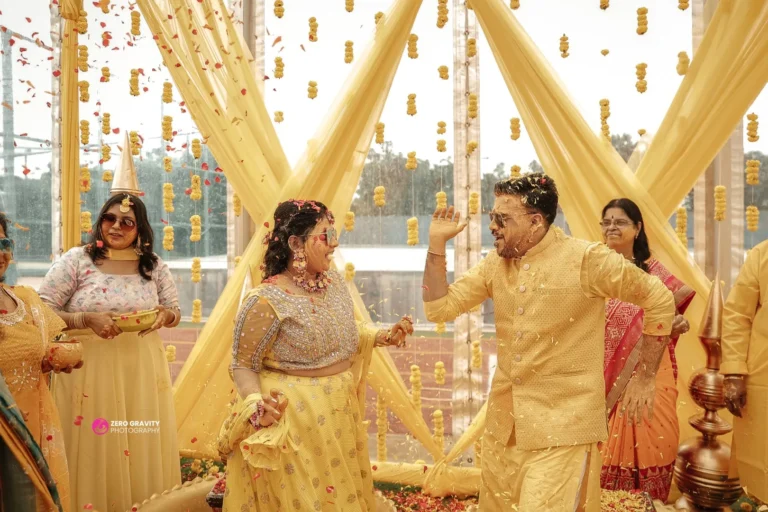Groom’s close-up portrait with soft bokeh lights in background