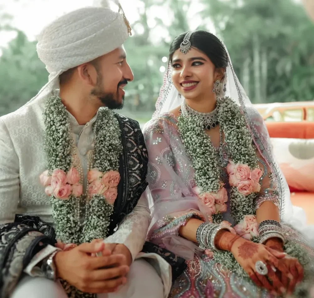 Bride and groom holding hands during nikah